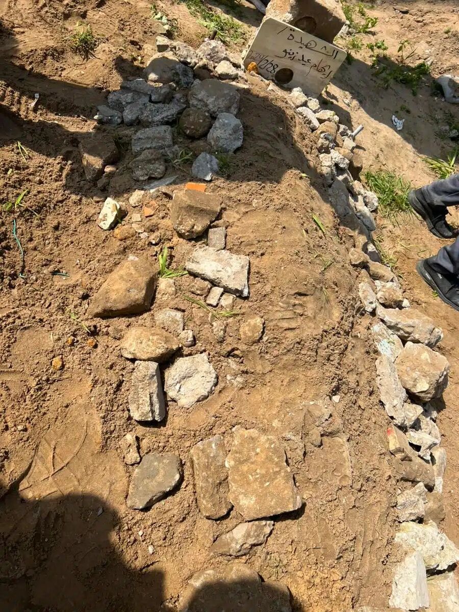 Click to enlarge Palestinian journalist Motasem Ahmed wife grave