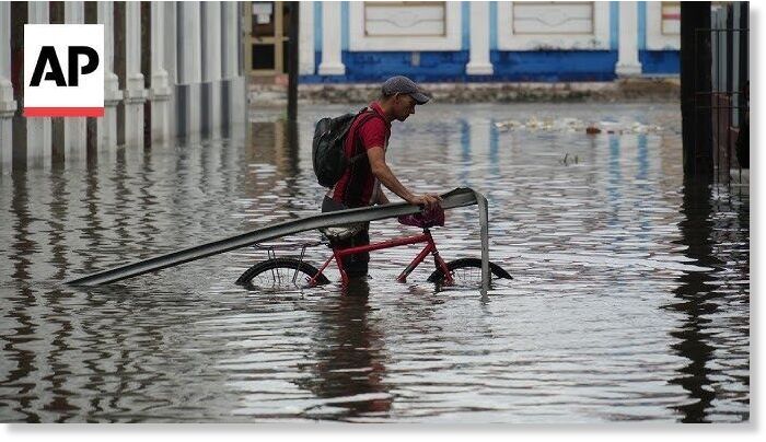 Click to enlarge Officials in Cuba reported collapsed houses, blocked mountain roads and roofs blown