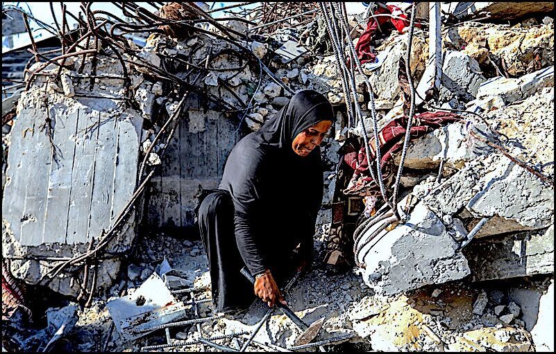 Click to enlarge Woman Home wreckage Khan Yunis