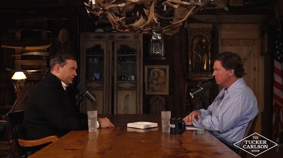 george santos tucker carlson interview prison experience