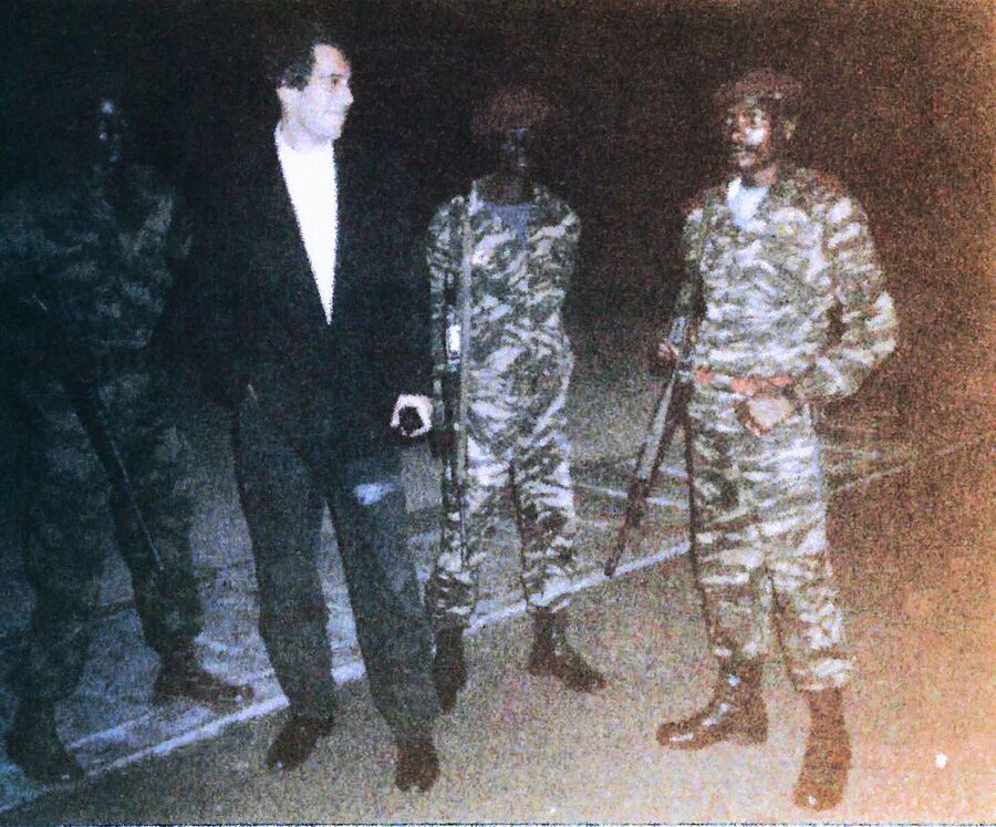 Click to enlarge Jeffrey Epstein with unidentified soldiers in Africa
