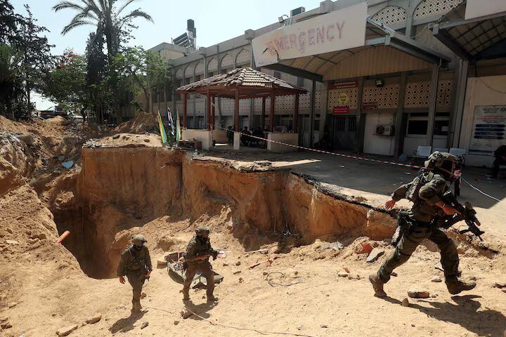 Click to enlarge Israeli soldiers walk out from a tunnel