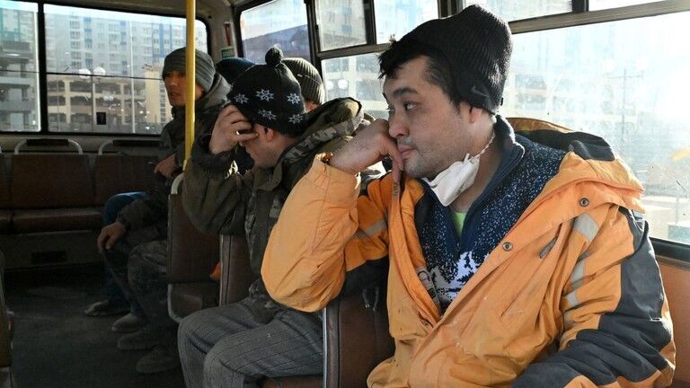 Click to enlarge Detained migrant workers sit in a police bus during a raid at a construction site in Krasnoyarsk, Russia, October 21, 2025.