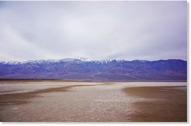 Click to enlarge A small Lake Manly has formed near Badwater Basin. The hike to the water is about one mile and is just a few inches deep.