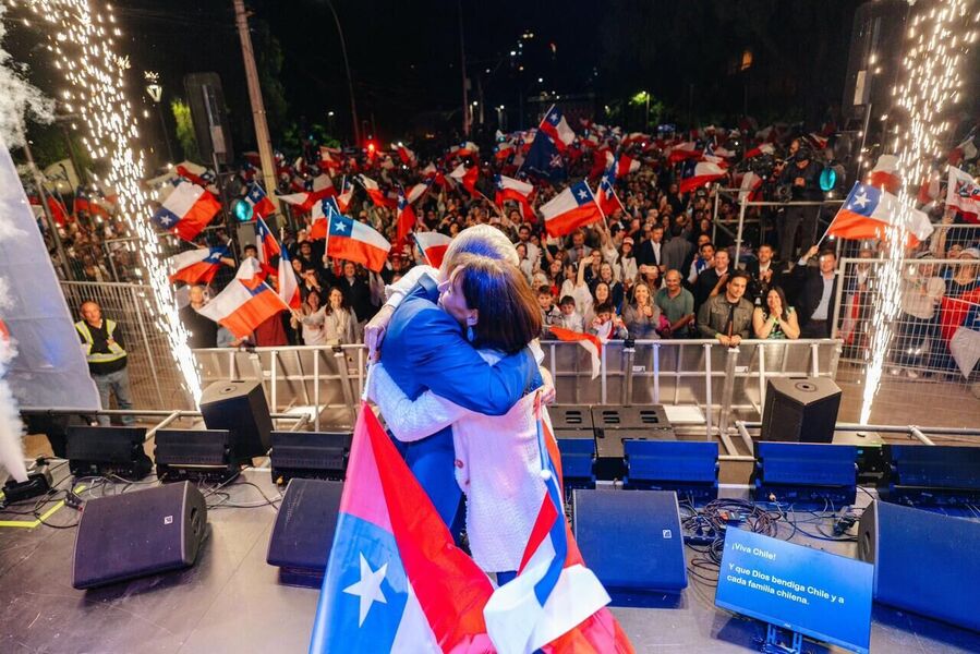 Click to enlarge Jose Antonio Kast embraces his wife at a rally in Chile