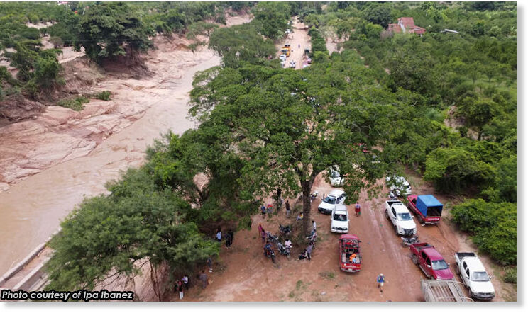 Click to enlarge A drone view shows flooded areas that left communities isolated after torrential rain in the community of El Torno, in Santa Cruz region, Bolivia, December 14, 2025.