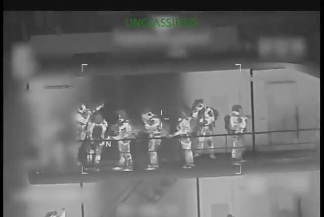 Click to enlarge Coast Guard troops are seen on board the tanker.