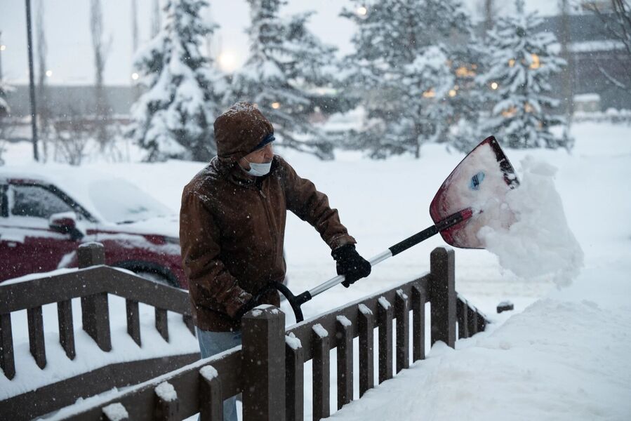 Alfredo Godoy shovels his front steps in Spenard on Jan. 27, 2026.