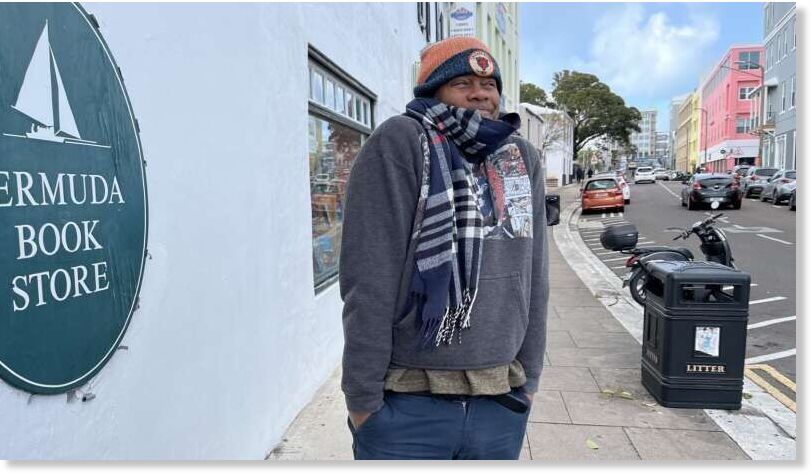 Click to enlarge All bundled up: after the mercury dropped to 45.1F this weekend, Scott Holder of the Bermuda Book Store wrapped up to survey conditions in Hamilton yesterday