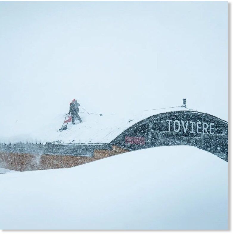 Click to enlarge Staff clearing snow from a lift station.