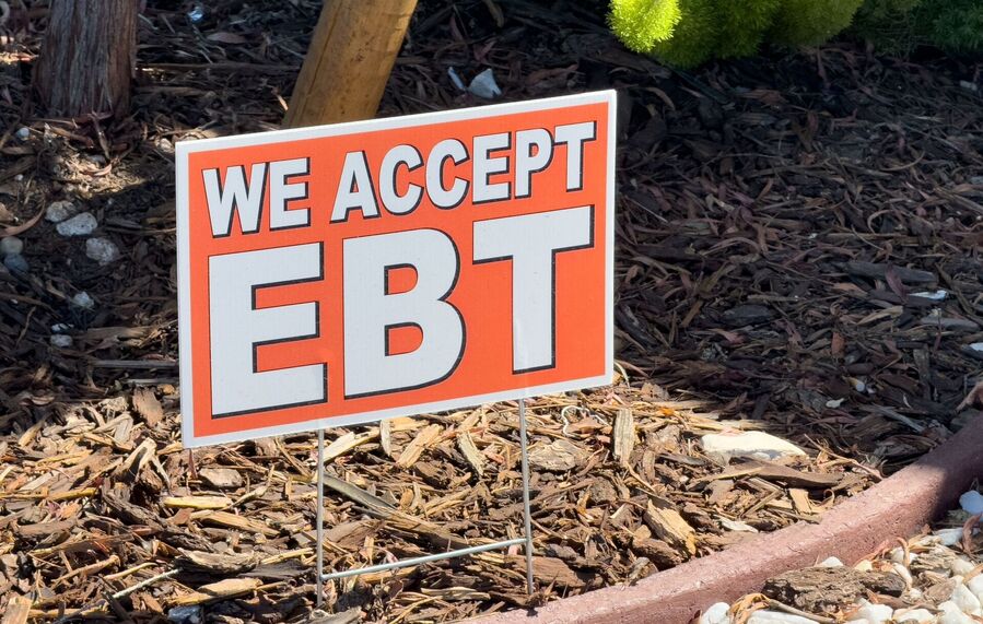 A sign in Los Angeles advertises a store accepting welfare payments