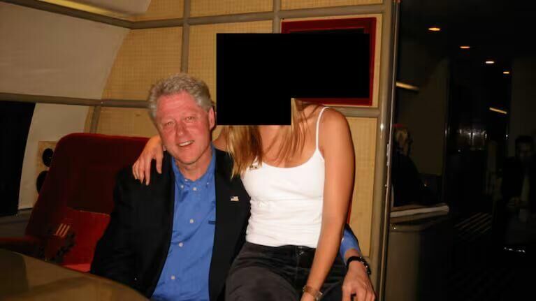 Click to enlarge Bill Clinton on plane with young woman