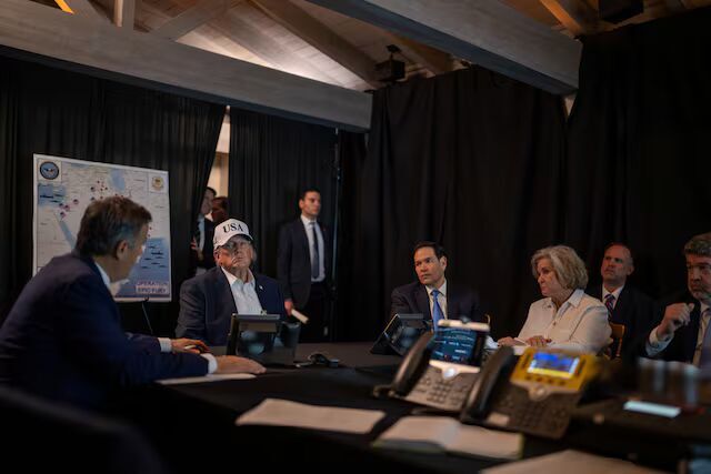Click to enlarge U.S. President Donald Trump speaks with CIA Director John Ratcliffe, accompanied by White House Chief of Staff Susie Wiles and Secretary of State Marco Rubio, during military operations in Iran