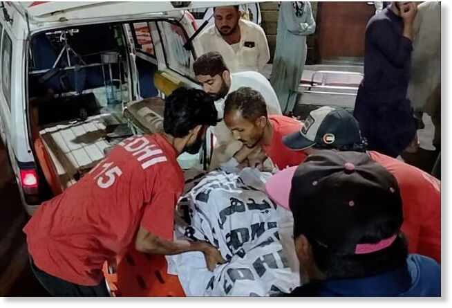 Click to enlarge Rescue workers carry the body of a victim who died in an incident due to heavy rain strong winds, upon arrival at a hospital in Karachi, Pakistan, Thursday, March 19, 2026.