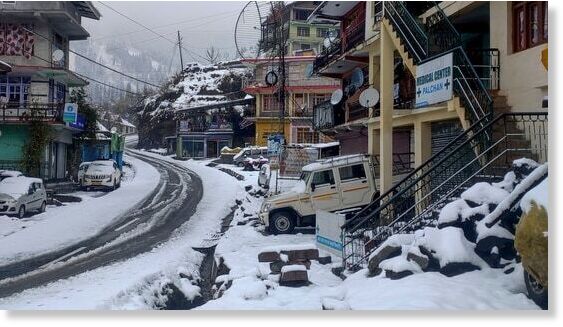 A view of snow-covered streets following fresh snowfall at Palchan village, in Kullu district.