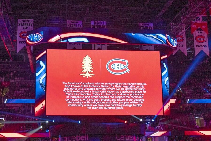 Click to enlarge scoreboard shows a message declaring an indigenous land acknowledgement