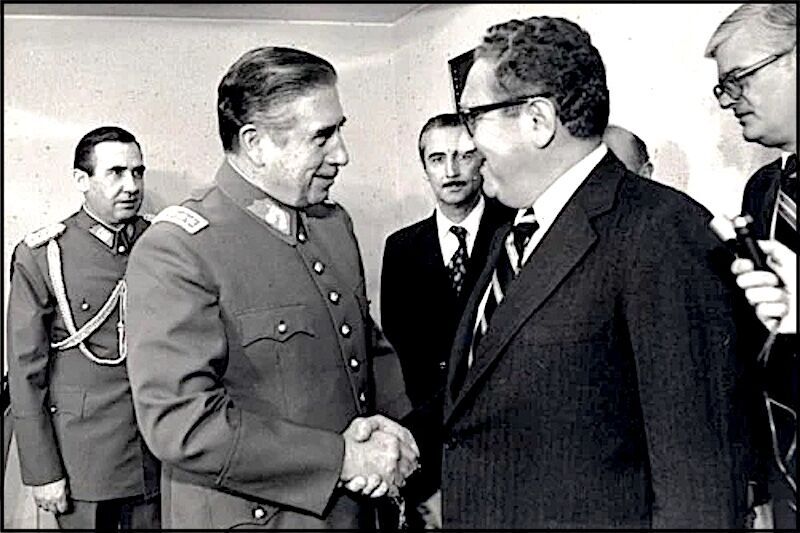 Click to enlarge Kissinger and someone