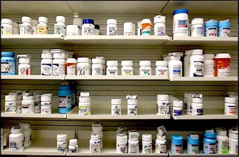 pharmacy shelf with drugs