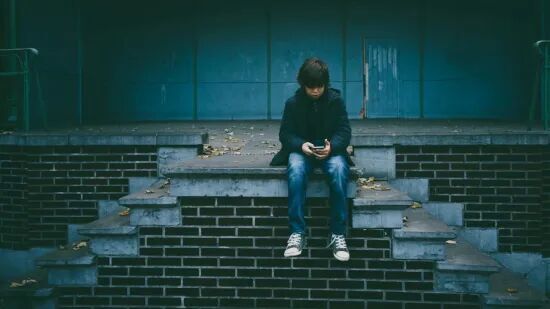 depressed child on phone
