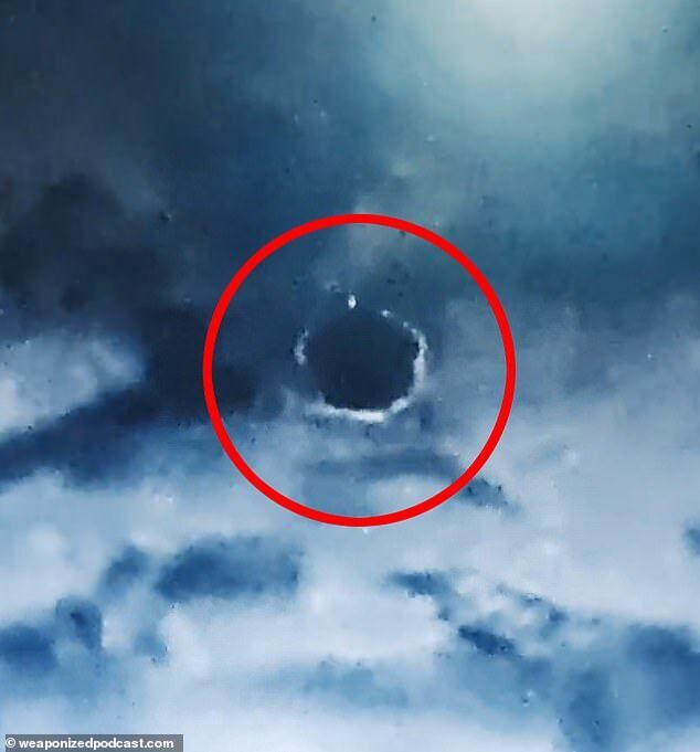 spherical ufo in clouds