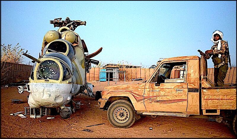 gunman and damaged helicopter