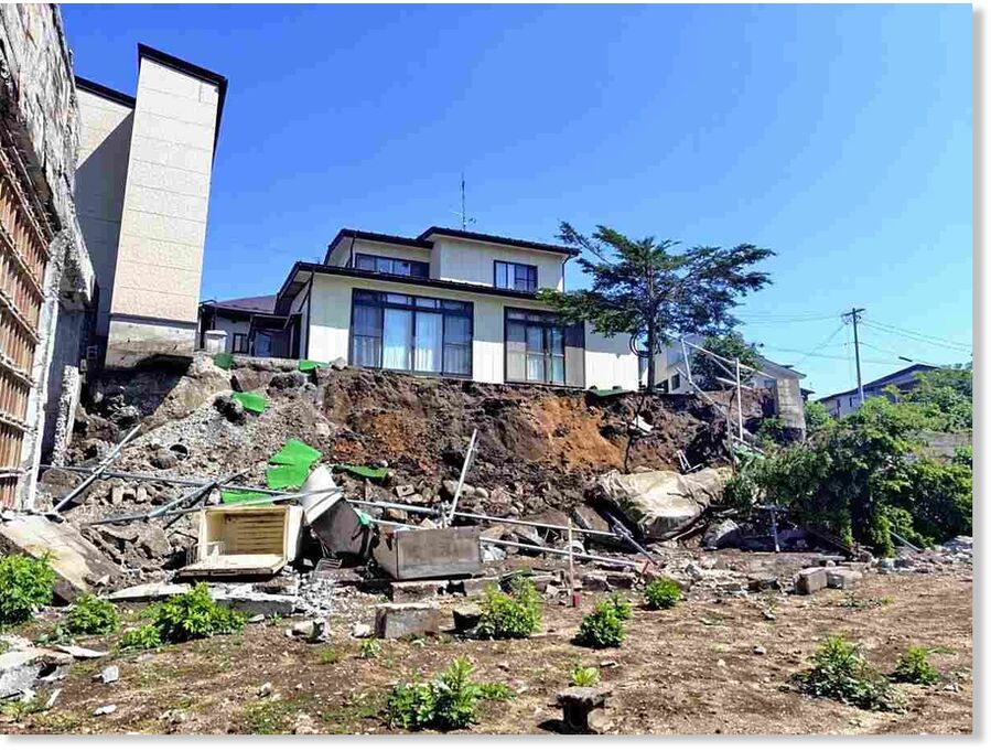 Retaining walls and concrete block walls are seen collapsed in Hachinohe, Aomori Prefecture, on Thursday morning.