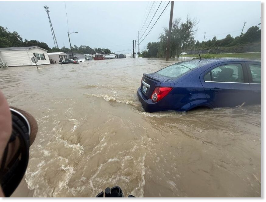 Floodwaters cover roads in Richmond, Kentucky, on June 27, where emergency responders have performed water rescues and blocked off flooded roadways.