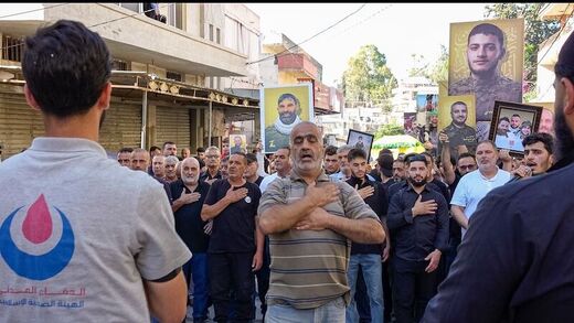 Click to enlarge Funeral procession in Harouf for Hezbollah fighters