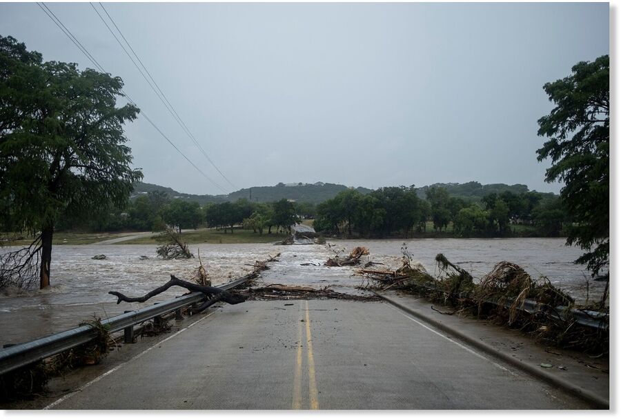Flooding blocks off G Street along the Guadalupe River, July 16, 2026, in Kerrville, Texas.