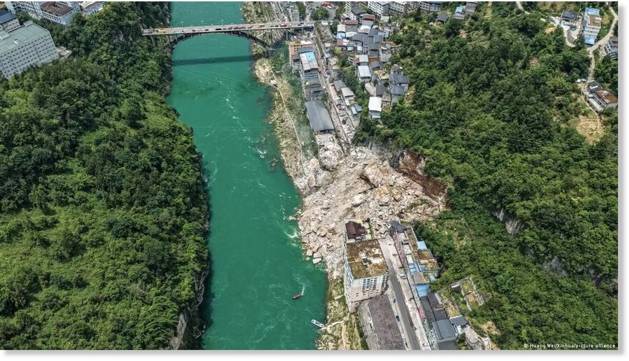 Click to enlarge A section of hillside collapsed in a rural part of southwest China's Chongqing Municipality