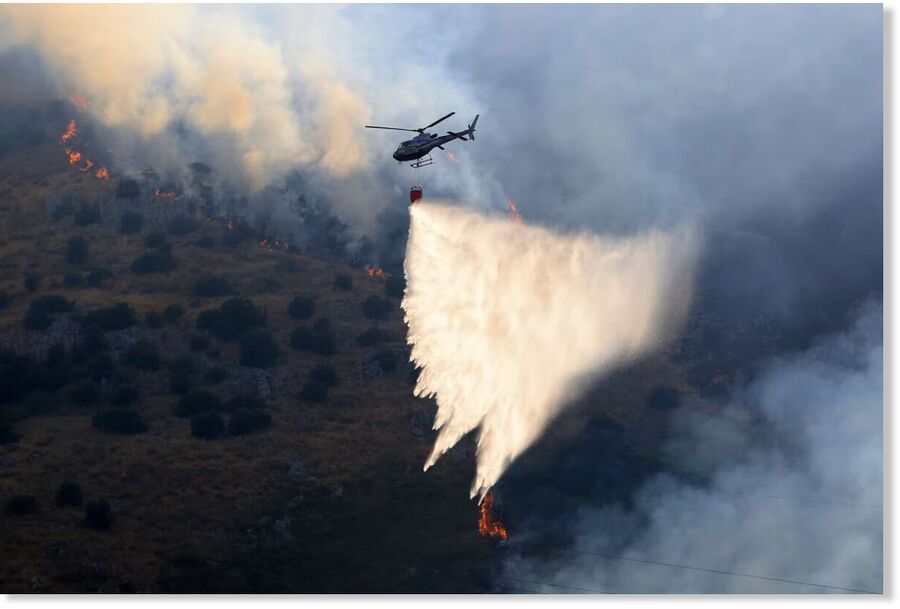 Firefighting aircraft and helicopters try