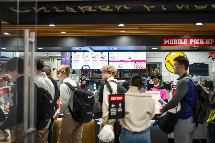Customers wait at Raising Canes Chicken Fingers in Washington