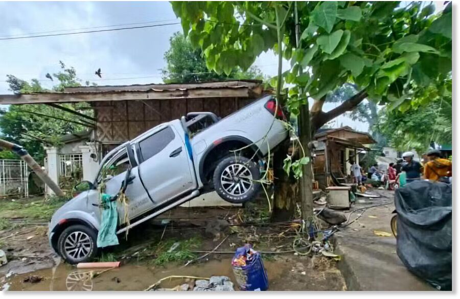 MORNING-AFTER CLEANUP A pickup truck ends up like just another piece of debris on Saturday after the flash flood at Barangay Talomo in Davao City, where the river overflowed due to nonstop rains