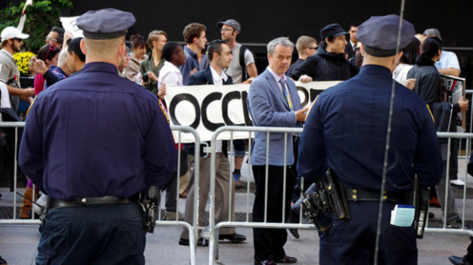 Click to enlarge NYPD officers observe Occupy Wall protesters