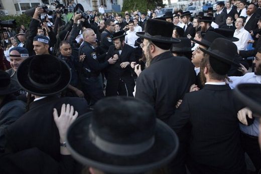 Israelis policemen disperse ultra Orthodox Jewish protesters