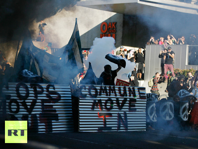 Oakland demonstrators shield themselves
