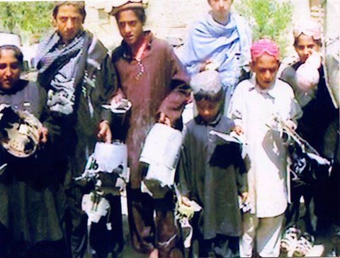Waziristan residents hold up missile fragments