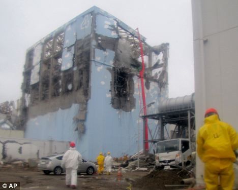 Workers try to make emergency repairs