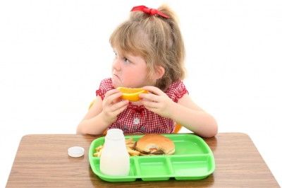 girl at school lunch frowning