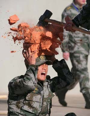 soldier having bricks smashed on head