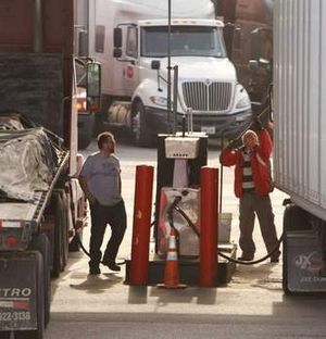  Truckers fill up at a truck stop last month in Rye, N.H.