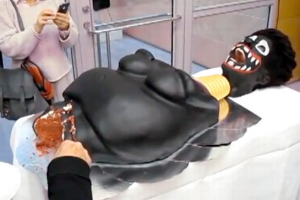 Click to enlarge racist cake