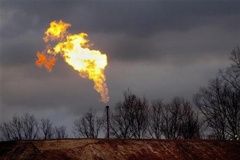 A gas flare burns at a fracking site in rural Bradford County, Pennsylvania January 9, 2012. 