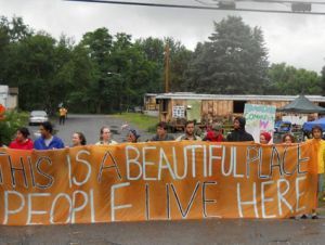 Residents and volunteers form a barricade at Riverdale Mobile Homes Park