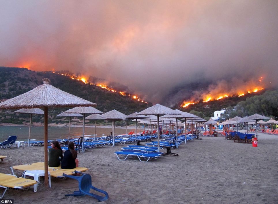 Firefighters Battle to Contain Wildfire on Greek Island Earth