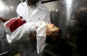 Palestinian medic carries the body