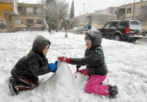 Children play in the snow in the Montenegrin