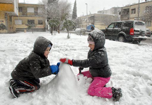 Click to enlarge Children play in the snow in the Montenegrin