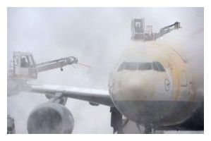 Click to enlarge De-Icing an Airplane