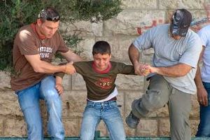 Click to enlarge Israeli undercover agents arresting a Palestinian boy